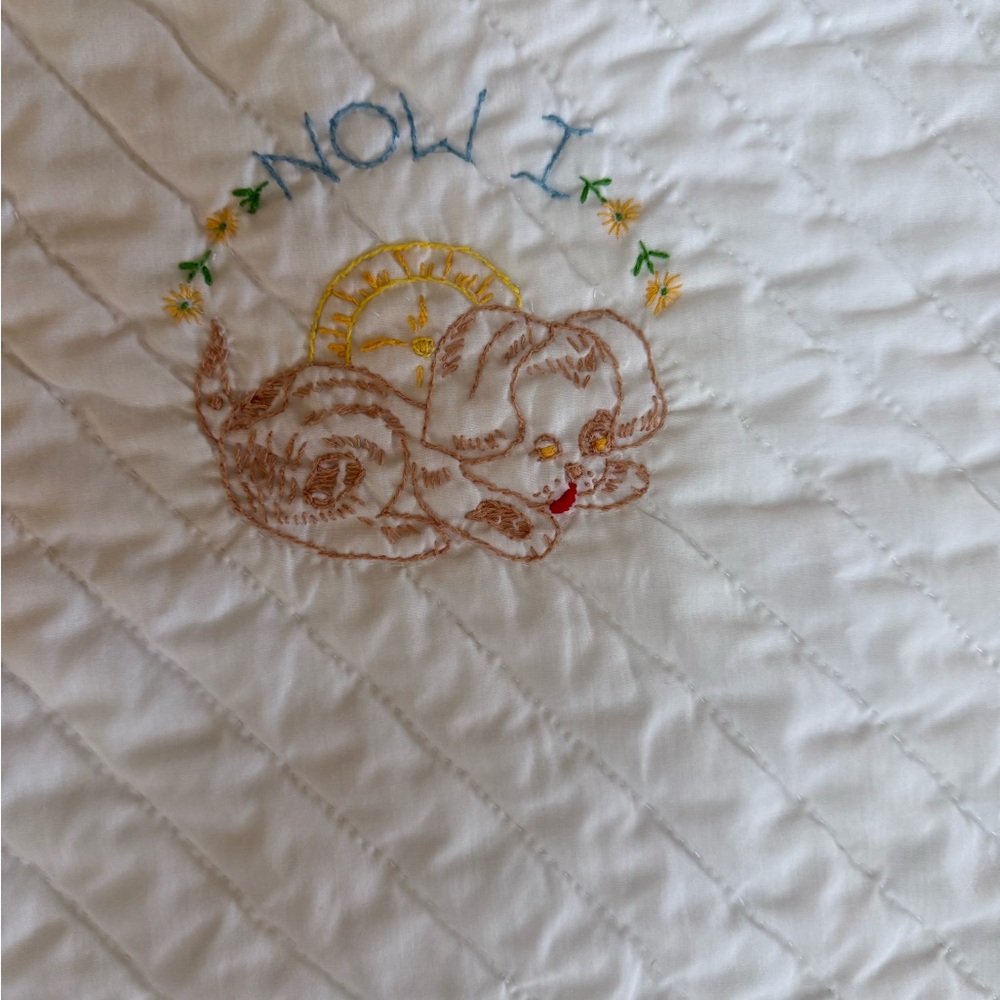 Made by hand embroidered baby quilt